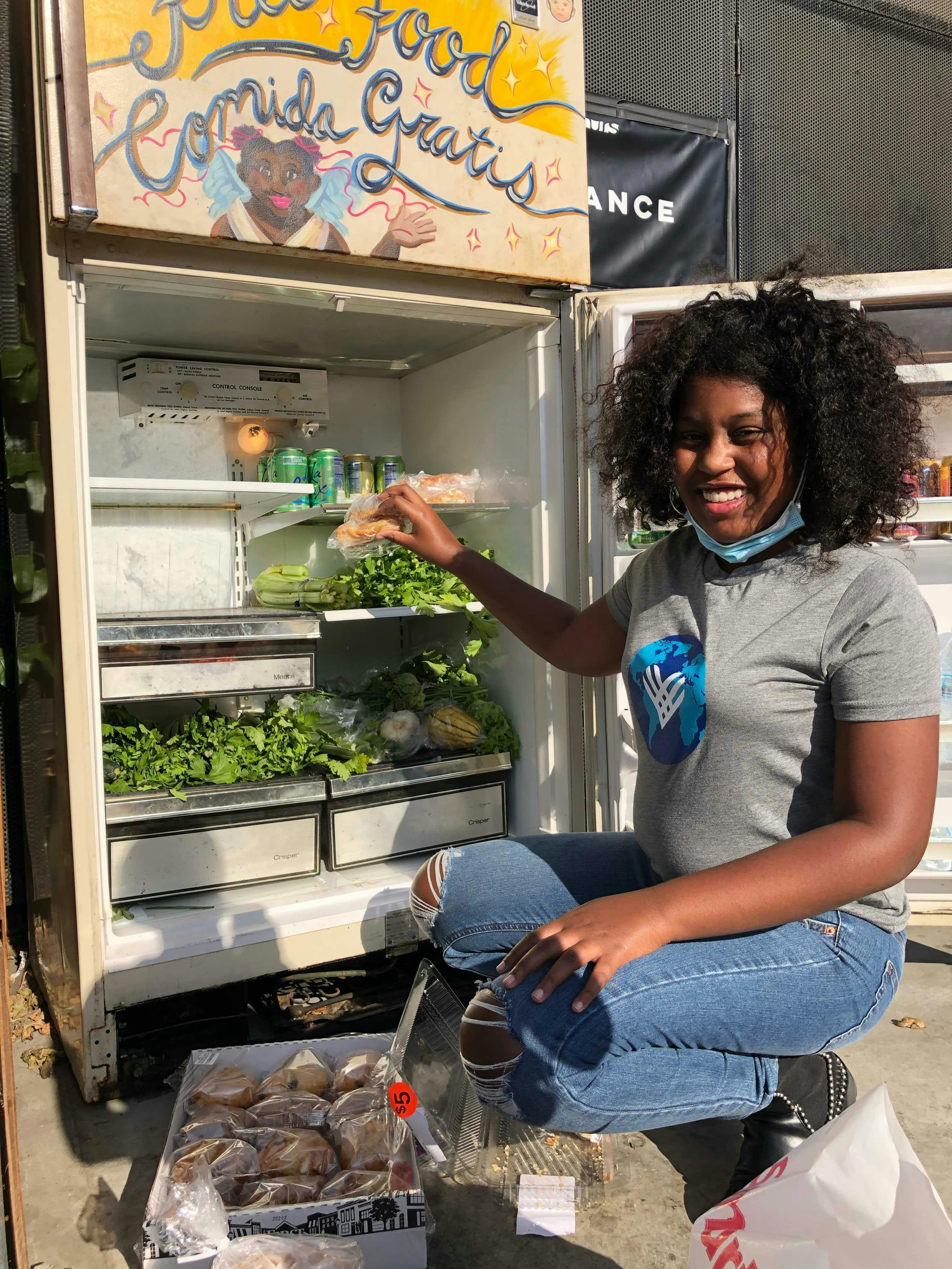 A Black woman supporting a community food and wellbeing initiative.